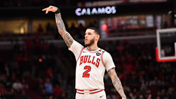 Feb 28, 2025; Chicago, Illinois, USA; Chicago Bulls forward Lonzo Ball (2) hits a three point shot against Toronto Raptors guard Jamal Shead (23) during overtime at the United Center. Mandatory Credit: Patrick Gorski-Imagn Images