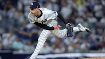 Sep 30, 2025; Bronx, New York, USA; New York Yankees relief pitcher Luke Weaver (30) follows through on a pitch against the Boston Red Sox during the seventh inning of game one of the Wildcard round of the 2025 MLB playoffs at Yankee Stadium. Mandatory Credit: Brad Penner-Imagn Images