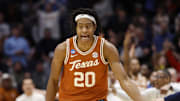 Mar 19, 2025; Dayton, OH, USA; Texas Longhorns guard Tre Johnson (20) high fives Xavier Musketeers head coach Sean Miller after making a three point basket in the second half at UD Arena. Mandatory Credit: Rick Osentoski-Imagn Images