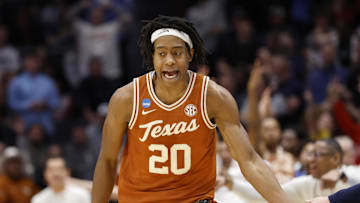 Mar 19, 2025; Dayton, OH, USA; Texas Longhorns guard Tre Johnson (20) high fives Xavier Musketeers head coach Sean Miller after making a three point basket in the second half at UD Arena. Mandatory Credit: Rick Osentoski-Imagn Images