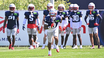 Jul 28, 2025; Foxborough, MA, USA; New England Patriots cornerback Christian Gonzalez (0) does a drill during training camp at Gillette Stadium. Mandatory Credit: Eric Canha-Imagn Images