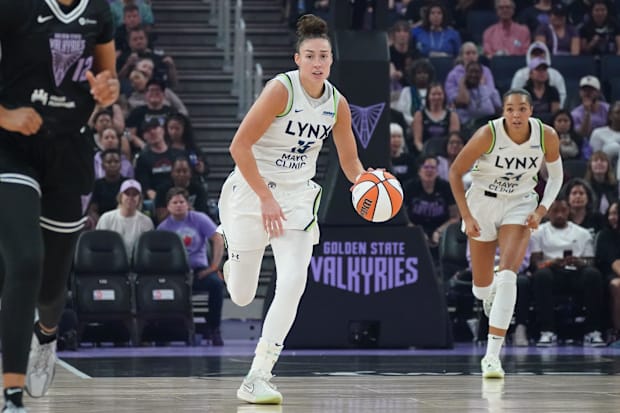 Minnesota Lynx forward Jessica Shepard dribbles up court. 