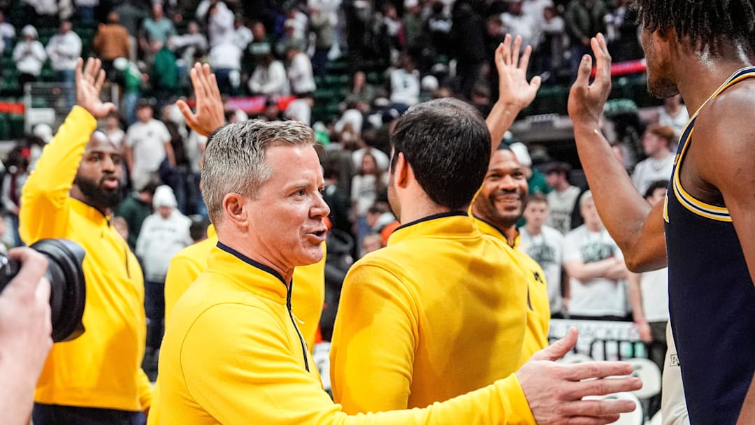 Michigan head coach Dusty May congratulate players after 83-71 win over Michigan State at Breslin Center in East Lansing on Friday, Jan. 30, 2026. Michigan head coach Dusty May congratulate players after 83-71 win over Michigan State at Breslin Center in East Lansing on Friday, Jan. 30, 2026.