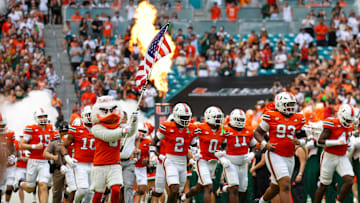 Sep 13, 2025; Miami Gardens, Florida, USA; Miami Hurricanes take the field for a game against the South Florida Bulls at Hard Rock Stadium. Mandatory Credit: Nathan Ray Seebeck-Imagn Images