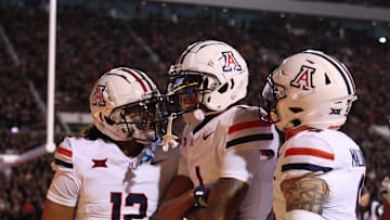 Sep 28, 2024; Salt Lake City, Utah, USA; Arizona Wildcats defensive back Genesis Smith (12) along with defensive back Tacario Davis (1) and defensive back Gunner Maldonado (9) react to a play against the Utah Utes during the second quarter at Rice-Eccles Stadium. Mandatory Credit: Rob Gray-Imagn Images