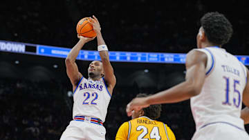Dec 7, 2025; Kansas City, Missouri, USA; Kansas Jayhawks guard Darryn Peterson (22) shoots against Missouri Tigers forward Nicholas Randall (24) during the first half at T-Mobile Center. Mandatory Credit: Jay Biggerstaff-Imagn Images