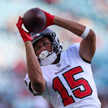 Aug 17, 2024; Jacksonville, Florida, USA; Tampa Bay Buccaneers wide receiver Jalen McMillan (15) warms up before a preseason game against the Jacksonville Jaguars at EverBank Stadium. Mandatory Credit: Nathan Ray Seebeck-Imagn Images