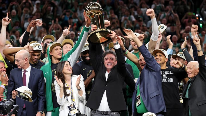 Jun 17, 2024; Boston, Massachusetts, USA; Boston Celtics owner Wyc Grousbeck holds the trophy after winning the 2024 NBA Finals against the Dallas Mavericks at TD Garden. Mandatory Credit: Peter Casey-USA TODAY Sports