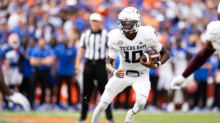 Sep 14, 2024; Gainesville, Florida, USA; Texas A&M Aggies quarterback Marcel Reed (10) runs with the ball against the Florida Gators during the first half at Ben Hill Griffin Stadium. Mandatory Credit: Matt Pendleton-Imagn Images