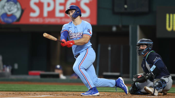 Jul 7, 2024; Arlington, Texas, USA; Texas Rangers left fielder Wyatt Langford (36) drives in a run with a double in the first inning against the Tampa Bay Rays at Globe Life Field. Mandatory Credit: Tim Heitman-USA TODAY Sports