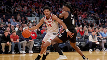 Mar 13, 2025; New York, NY, USA; St. John's basketball guard RJ Luis Jr. (12) drives to the basket against Butler Bulldogs forward Jahmyl Telfort (11) during the second half at Madison Square Garden.