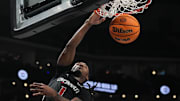 Bearcats Day Day Thomas (1) leaps and scores during Game 1 of the 2025 Phillips 66 Big 12 Basketball Championship against the Oklahoma State Cowboys at the T-Mobile Center in Kansas City, Missouri on Tuesday March 11, 2025. Bearcats lead the game at halftime with a score of 38-26.