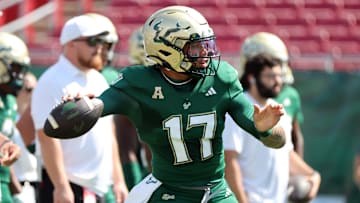 Byrum Brown threw four touchdown passes to lead the Bulls rout of South Carolina State