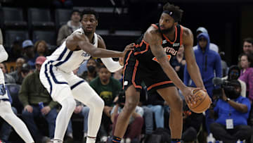 Mar 11, 2022; Memphis, Tennessee, USA; New York Knicks center Mitchell Robinson (23) looks for an open lane as Memphis Grizzlies forward Jaren Jackson Jr. (13) defends during the second half at FedExForum. Mandatory Credit: Petre Thomas-Imagn Images