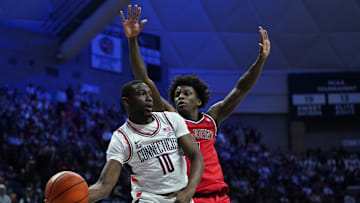 Feb 7, 2025; Storrs, Connecticut, USA; UConn Huskies guard Hassan Diarra (10) passes the ball against St. John's Red Storm guard Kadary Richmond (1) in the first half at Harry A. Gampel Pavilion. Mandatory Credit: David Butler II-Imagn Images
