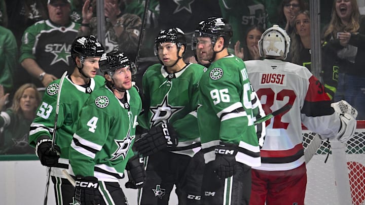 Oct 25, 2025; Dallas, Texas, USA; Dallas Stars defenseman Miro Heiskanen (4) and center Wyatt Johnston (53) and left wing Jason Robertson (21) and right wing Mikko Rantanen (96) celebrates the game winning goal by Heiskanen against Carolina Hurricanes goaltender Brandon Bussi (32) during the third period at the American Airlines Center. Mandatory Credit: Jerome Miron-Imagn Images