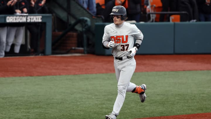 Jun 12, 2022; Corvallis, OR, USA; Oregon State Beavers infielder Travis Bazzana (37) runs the bases after hitting a home run against the Auburn Tigers in the 4th inning  during Game 2 of a NCAA Super Regional game at Coleman Field. Mandatory Credit: Soobum Im-USA TODAY Sports