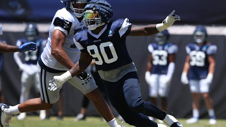 Dallas Cowboys defensive end DeMarcus Lawrence rushes during training camp.