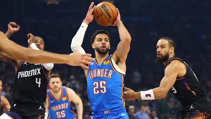 Apr 27, 2026; Phoenix, Arizona, USA; Oklahoma City Thunder guard Ajay Mitchell (25) against Phoenix Suns forward Dillon Brooks (3) in the first half during game four of the first round of the 2026 NBA Playoffs at Mortgage Matchup Center. Mandatory Credit: Mark J. Rebilas-Imagn Images