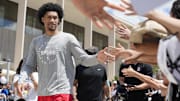 Jun 28, 2025; San Antonio, TX, USA; San Antonio Spurs first round draft pick Dylan Harper (2) greets fans at Victory Capital Performance Center.