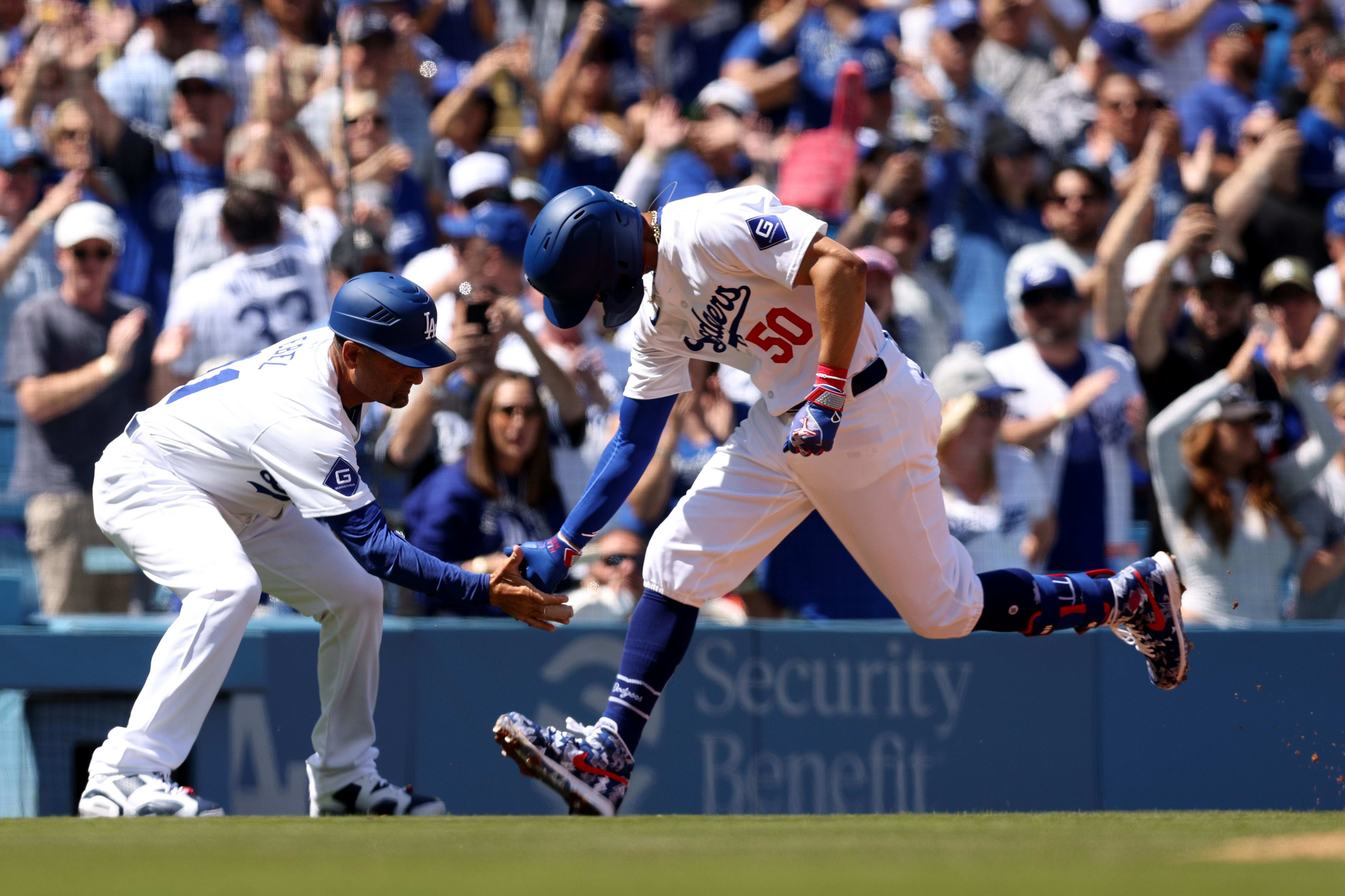 Los Angeles Dodgers outfielder Mookie Betts hits a home run.