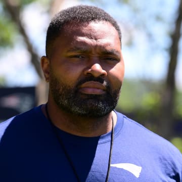 Jun 10, 2024; Foxborough, MA, USA;  New England Patriots head coach Jerod Mayo  walks to a press conference before minicamp at Gillette Stadium. Mandatory Credit: Eric Canha-USA TODAY Sports