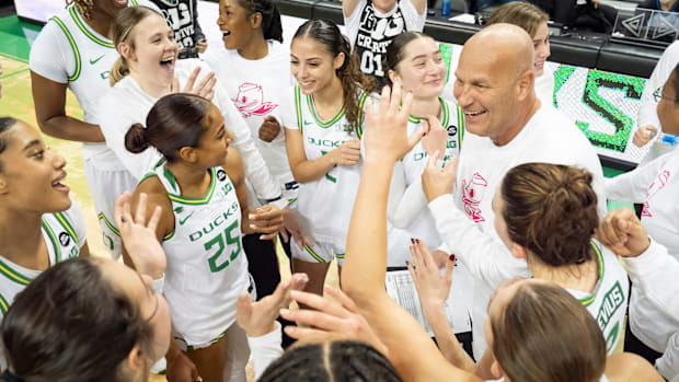 Oregon head coach Kelly Graves celebrates with his players as the Oregon Ducks host the Indiana Hoosiers Friday, Jan. 24, 202