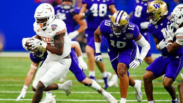 Jan 1, 2024; New Orleans, LA, USA; Texas Longhorns running back CJ Baxter (4) runs the ball against Washington Huskies lineba