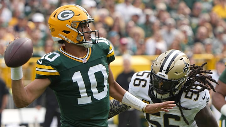 Green Bay Packers quarterback Jordan Love (10) is pressured by New Orleans Saints linebacker Demario Davis in 2023.