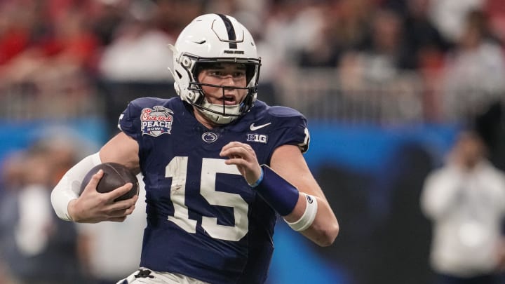 Dec 30, 2023; Atlanta, GA, USA; Penn State Nittany Lions quarterback Drew Allar (15) runs with the ball against the Mississippi Rebels during the second half at Mercedes-Benz Stadium. Mandatory Credit: Dale Zanine-USA TODAY Sports