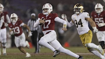 Nov 29, 2025; Stanford, California, USA;  Stanford Cardinal quarterback Charlie Mirer (17) runs with the football during the fourth quarter against the Notre Dame Fighting Irish at Stanford Stadium.