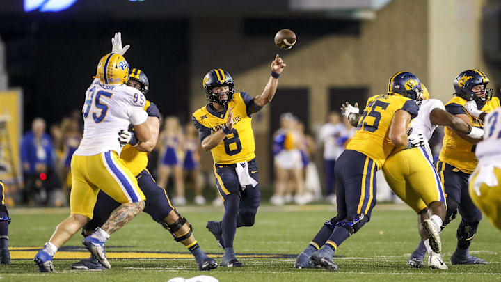 Sep 16, 2023; Morgantown, West Virginia, USA; West Virginia Mountaineers quarterback Nicco Marchiol (8) throws a pass during the first quarter against the Pittsburgh Panthers at Mountaineer Field at Milan Puskar Stadium. Sep 16, 2023; Morgantown, West Virginia, USA; West Virginia Mountaineers quarterback Nicco Marchiol (8) throws a pass during the first quarter against the Pittsburgh Panthers at Mountaineer Field at Milan Puskar Stadium.