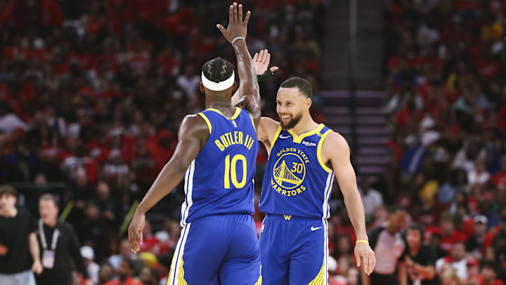 Apr 20, 2025; Houston, Texas, USA; Golden State Warriors guard Stephen Curry (30) celebrates with forward Jimmy Butler III (10) after a play during the third quarter against the Houston Rockets at Toyota Center. Mandatory Credit: Troy Taormina-Imagn Images