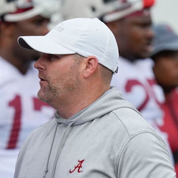 July 30, 2025; Tuscaloosa, AL, USA; Defensive coordinator Kane Wommack talks to defensive lineman London Simmons during the first practice session of the preseason for the Alabama Crimson Tide.