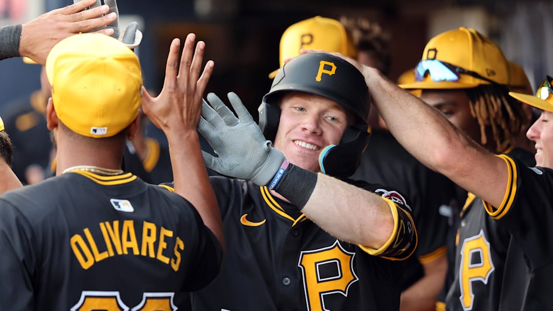 Mar 15, 2024; Tampa, Florida, USA; Pittsburgh Pirates infielder Jack Brannigan (83) celebrates with teammates in the dugout after hitting a home run during the third inning against the New York Yankees at George M. Steinbrenner Field. Mandatory Credit: Kim Klement Neitzel-Imagn Images