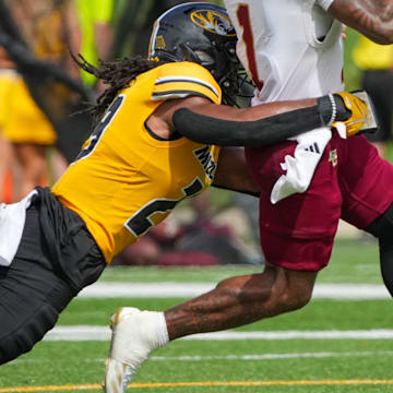 Sep 14, 2024; Columbia, Missouri, USA; Boston College Eagles quarterback Thomas Castellanos (1) runs the ball as Missouri Tigers linebacker Khalil Jacobs (29) makes the tackle during the second half at Faurot Field at Memorial Stadium. Mandatory Credit: Denny Medley-Imagn Images