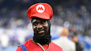  Injured Detroit Lions safety Kerby Joseph (31) looks on dressed as Super Mario during warm ups prior to Vikings game