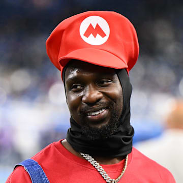  Injured Detroit Lions safety Kerby Joseph (31) looks on dressed as Super Mario during warm ups prior to Vikings game