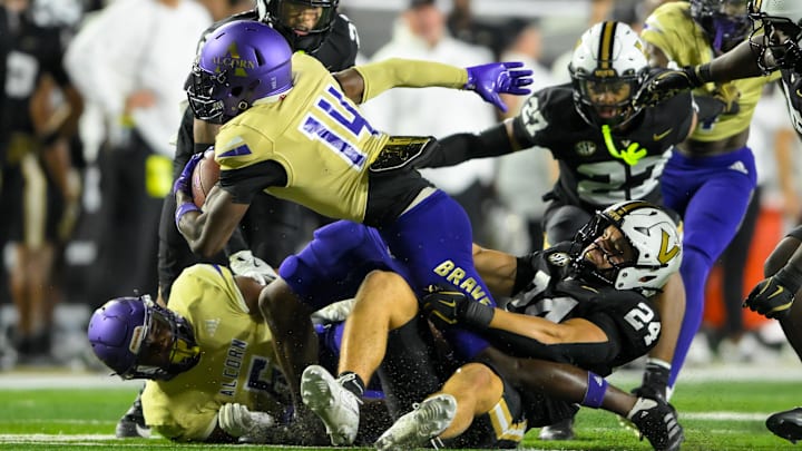 Vanderbilt Commodores linebacker Nicholas Rinaldi (24) tackles Alcorn State Braves wide receiver Anthony Williams (14) for a loss during the second half at FirstBank Stadium. Vanderbilt Commodores linebacker Nicholas Rinaldi (24) tackles Alcorn State Braves wide receiver Anthony Williams (14) for a loss during the second half at FirstBank Stadium.