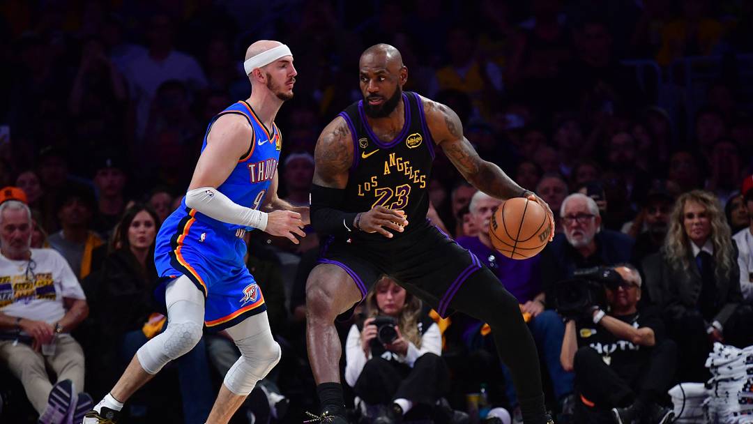 May 11, 2026; Los Angeles, California, USA; Los Angeles Lakers forward LeBron James (23) moves the ball against Oklahoma City Thunder guard Alex Caruso (9) during the second half in game four of the second round of the 2026 NBA Playoffs at Crypto.com Arena. Mandatory Credit: Gary A. Vasquez-Imagn Images