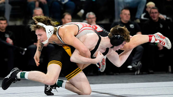 Bettendorf’s Timothy Koester wrestles Odessa’s Blaine Wallace in the 132-pound championship match during the Dan Gable Donnybrook wrestling tournament finals Saturday.