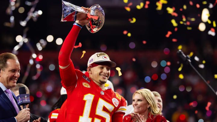 Feb 11, 2024; Paradise, Nevada, USA; Kansas City Chiefs quarterback Patrick Mahomes (15) celebrates with the Vince Lombardi Trophy after defeating the San Francisco 49ers in overtime of Super Bowl LVIII at Allegiant Stadium. Mandatory Credit: Mark J. Rebilas-USA TODAY Sports