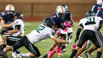 Timberwolves linebacker Reid Vines (42) slices in to tackle Glenn's DJ Dugar (7) as Cedar Park frustrated the Grizzlies' rushing attack in a 21-10 district victory Oct. 21 at Bible Stadium.

Fg8a8542 Copy