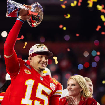 Feb 11, 2024; Paradise, Nevada, USA; Kansas City Chiefs quarterback Patrick Mahomes (15) celebrates with the Vince Lombardi Trophy after defeating the San Francisco 49ers in overtime of Super Bowl LVIII at Allegiant Stadium. Mandatory Credit: Mark J. Rebilas-USA TODAY Sports