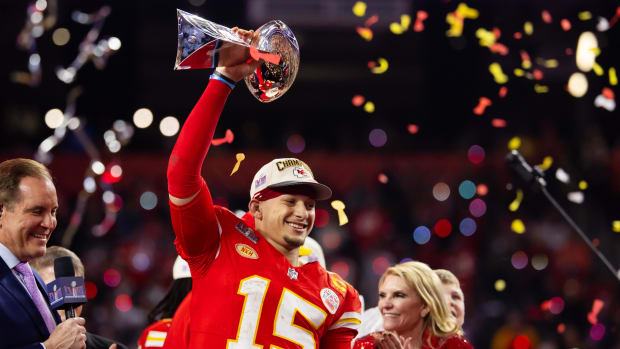 Kansas City Chiefs quarterback Patrick Mahomes (15) celebrates with the Vince Lombardi Trophy after defeating the 49ers