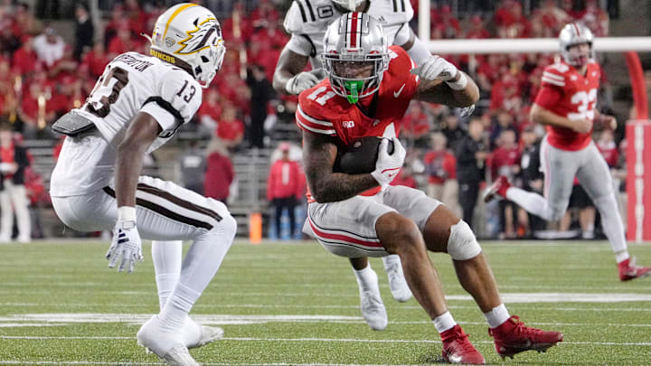 Sept. 7, 2024; Columbus, Ohio, USA;
Ohio State Buckeyes wide receiver Brandon Inniss (11) is pursued by Western Michigan Broncos cornerback Nyquann Washington (13) during the second half of an NCAA Division I football game on Saturday at Ohio Stadium.