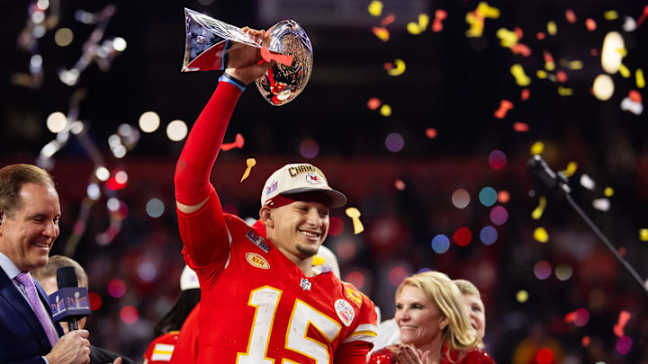 Feb 11, 2024; Paradise, Nevada, USA; Kansas City Chiefs quarterback Patrick Mahomes (15) celebrates with the Vince Lombardi Trophy after defeating the San Francisco 49ers in overtime of Super Bowl LVIII at Allegiant Stadium. Mandatory Credit: Mark J. Rebilas-Imagn Images