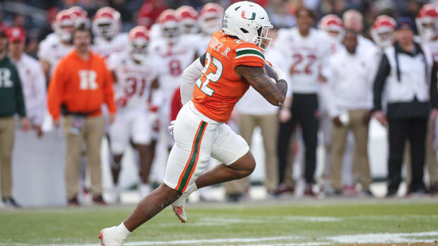 Miami Hurricanes running back Mark Fletcher Jr. (22) carries the ball during the first half of the 2023 Pinstripe Bowl agains