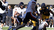 Nov 1, 2025; Berkeley, California, USA; Virginia Cavaliers quarterback Chandler Morris (4) carries the ball on a quarterback keeper against the California Golden Bears during the fourth quarter at California Memorial Stadium. Mandatory Credit: D. Ross Cameron-Imagn Images