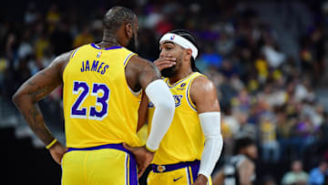 Oct 9, 2023; Las Vegas, Nevada, USA; Los Angeles Lakers forward LeBron James (23) speaks with guard Gabe Vincent (7) during the first half at T-Mobile Arena. Mandatory Credit: Gary A. Vasquez-Imagn Images